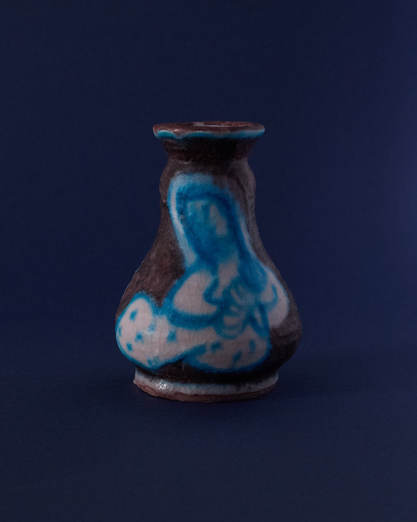 Front view of ceramic vase by Guido Gambone (c.1940s) — blue figure with contrasting dark glaze.