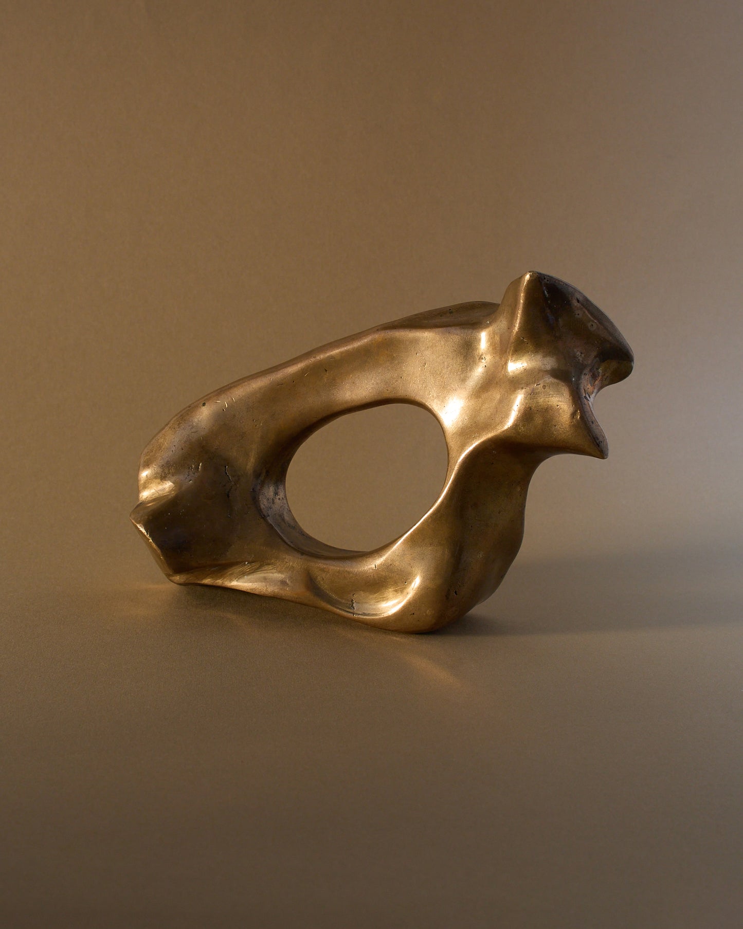 James Mercurin bronze sculpture (c.1990s) — organic shape with irregular, curved edges.