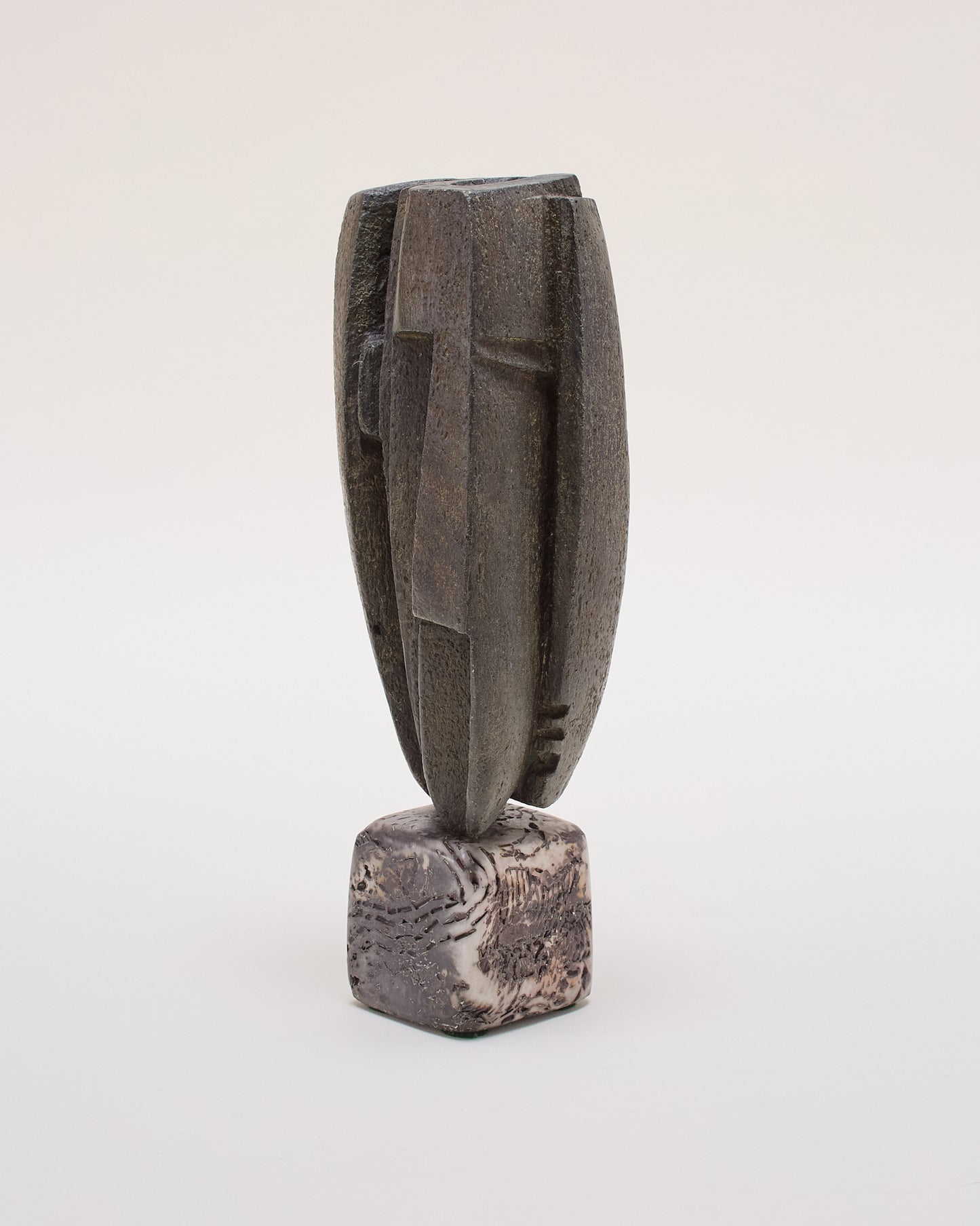 Ceramic sculpture by Peter Hayes — tall, textured form with irregular linear details.