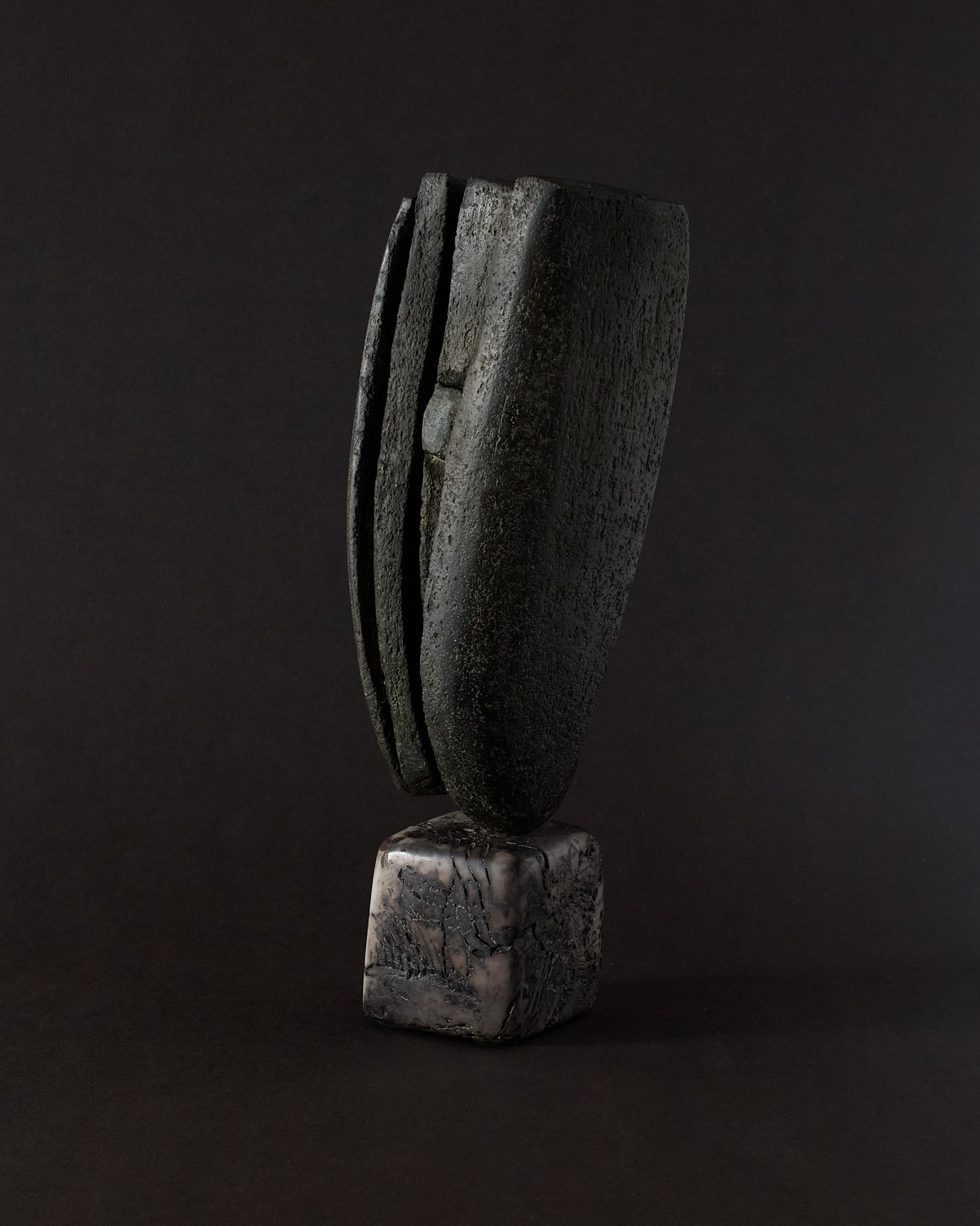 Ceramic sculpture by Peter Hayes — upright, organic form with raku base.