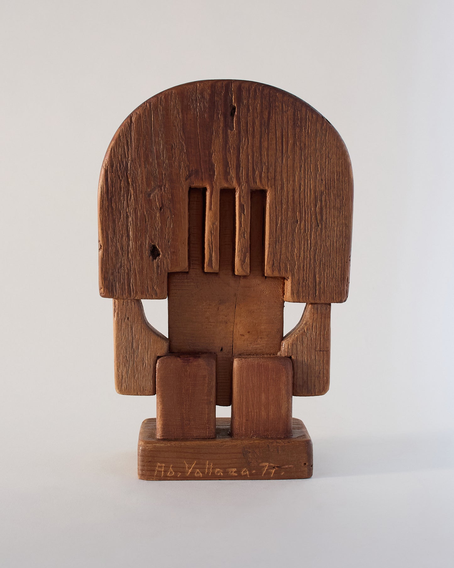 Back view of Vallazza sculpture (1977) — carved abstract shapes with visible grain.