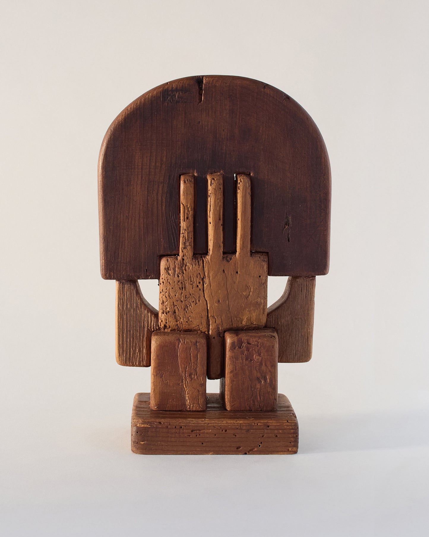 Alternate view of Adolf Vallazza wooden sculpture (1977) — raw surface with textured detail.