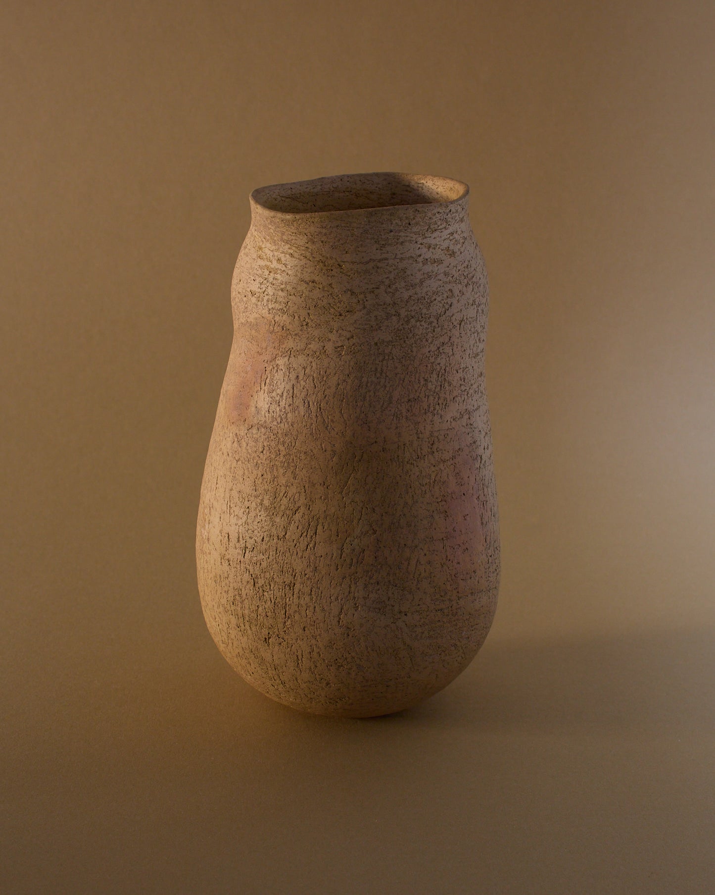 Side view of Elspeth Owen ceramic vase (c.2000s) — softly contoured body and smoke-fired finish.