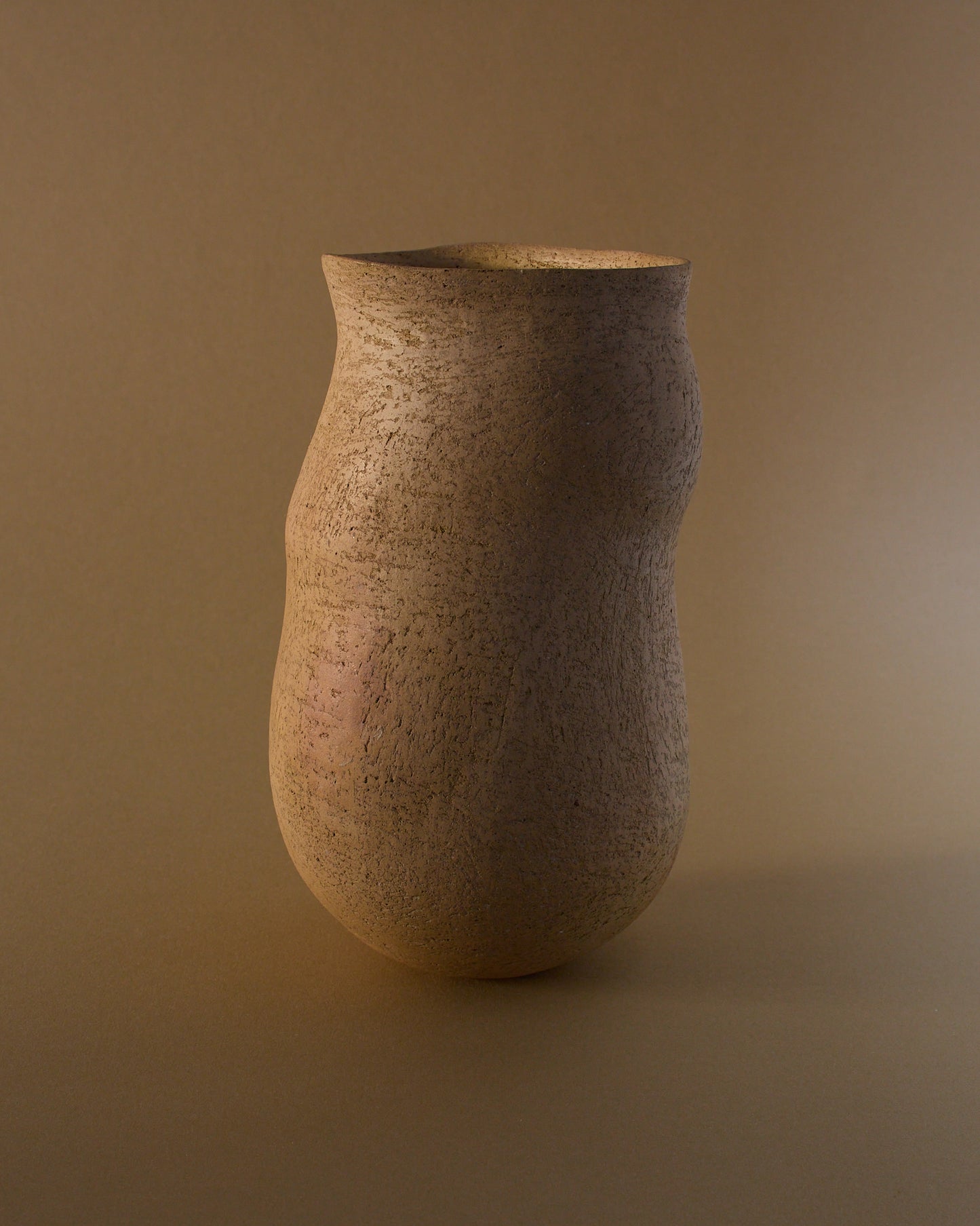 Alternate angled view of Elspeth Owen ceramic vase (c.2000s) — undulating form and natural surface texture.