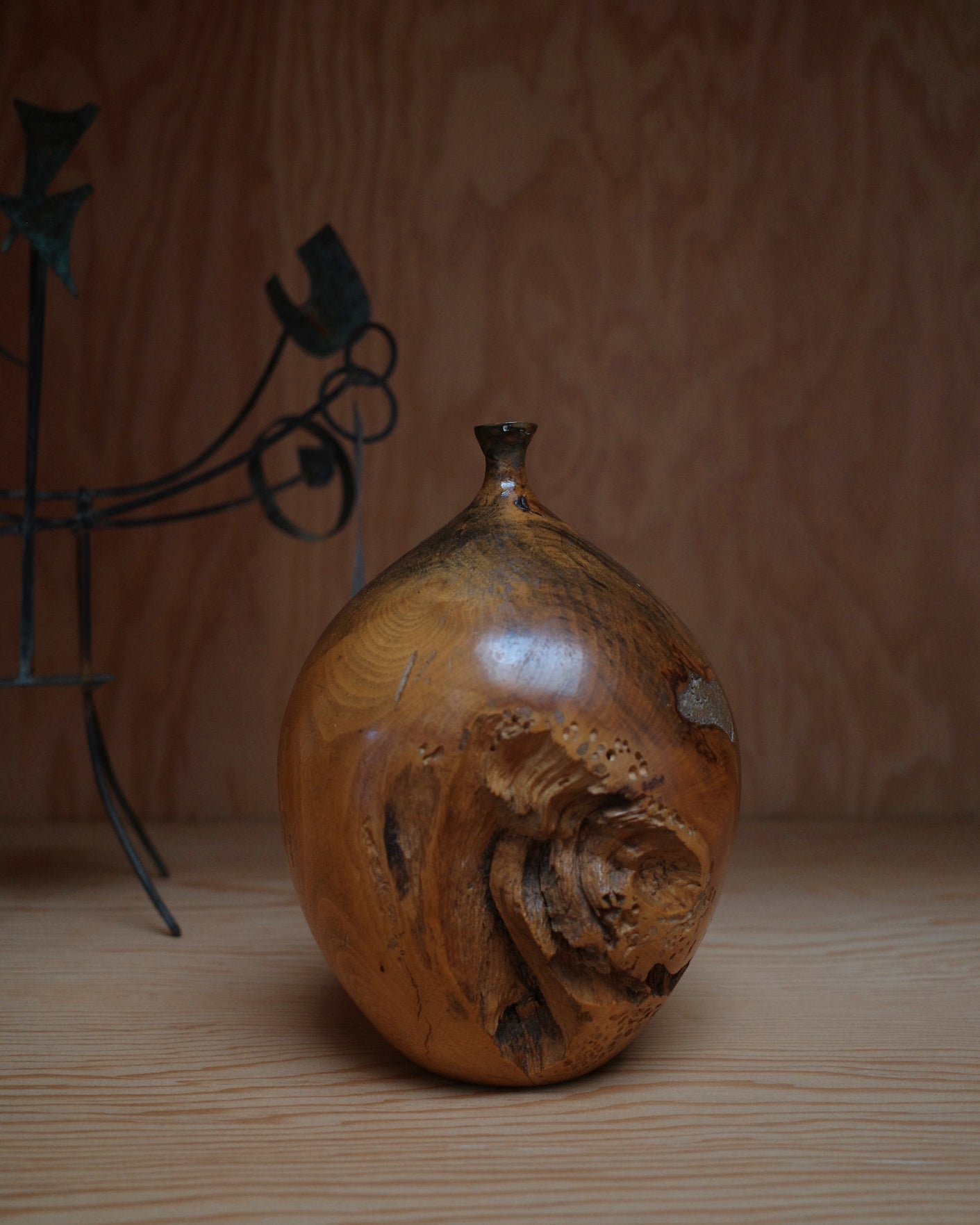 Wooden vase by Hap Sakwa (1980), hand-turned from Buckeye root. Photographed on shelf to provide scale.