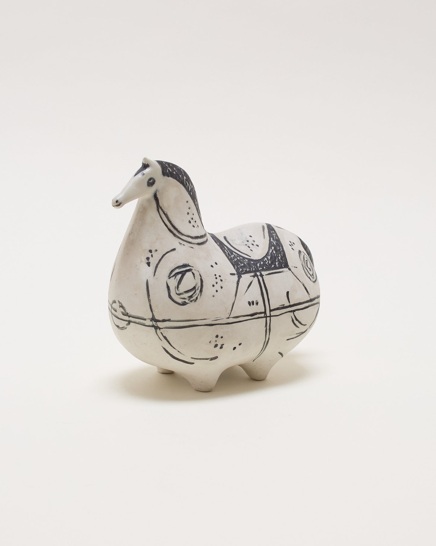Side angled view left of Springare ceramic sculpture by Stig Lindberg for Gustavsberg, featuring a stylised horse form, hand-decorated and numbered.