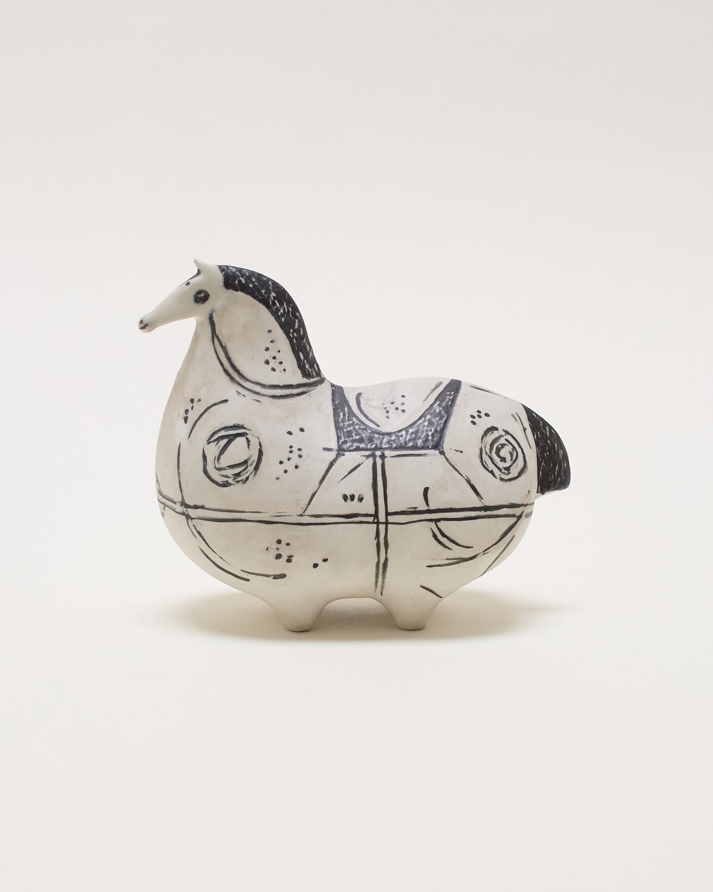 Side view left of Springare ceramic sculpture by Stig Lindberg for Gustavsberg, featuring a stylised horse form, hand-decorated and numbered.