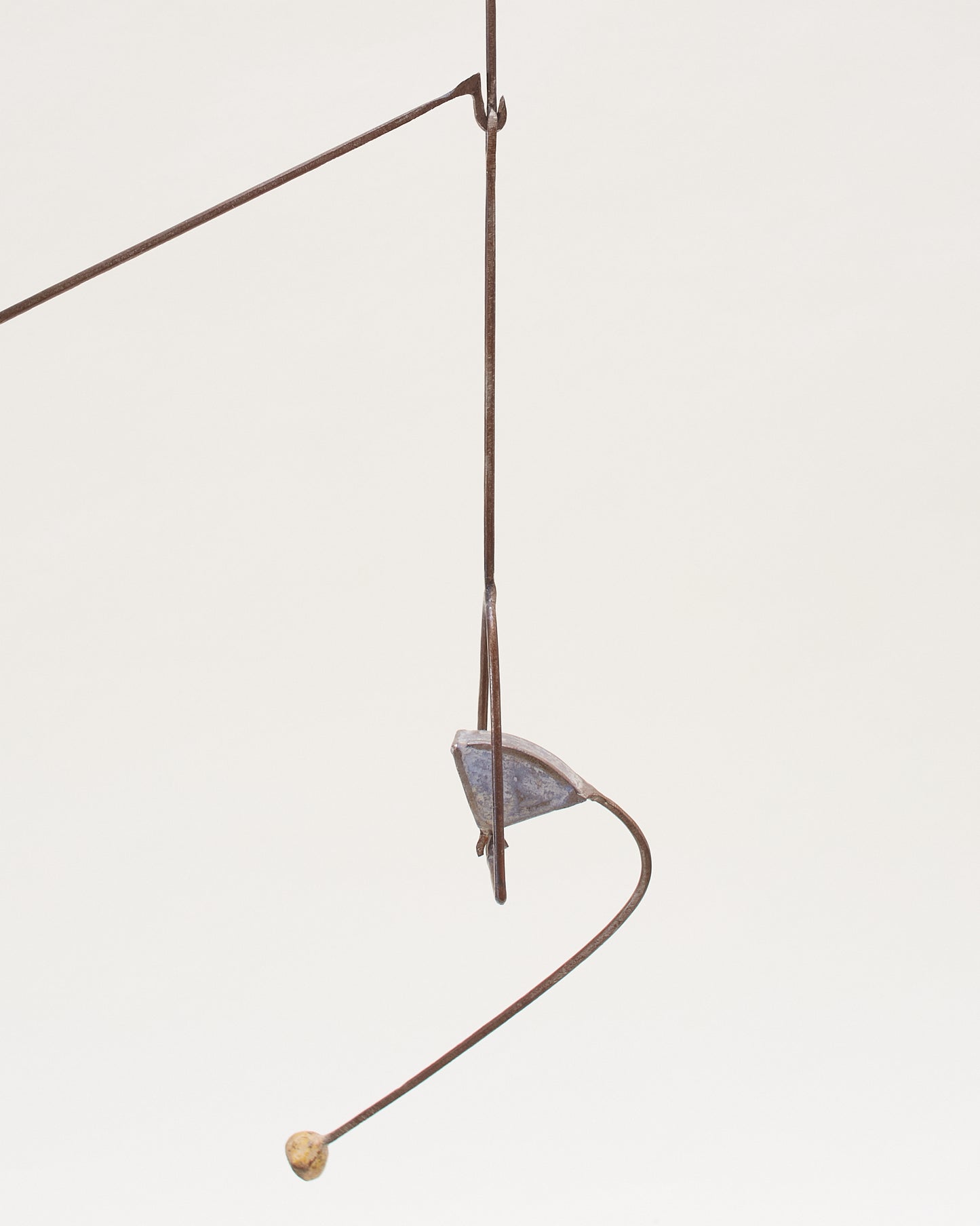 Detail view of a kinetic component on the abstract sculpture (20th century) by Thierry Dufourmantelle, featuring four moving parts, constructed from steel and concrete with pastel yellow, turquoise, and blue pigments.