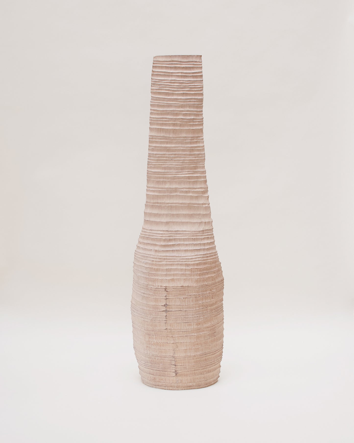 Back view of hand-carved oak sculpture by Malcolm Martin & Gaynor Dowling, featuring a vessel-like form with hand-tooled ridges and a limed, scorched finish.