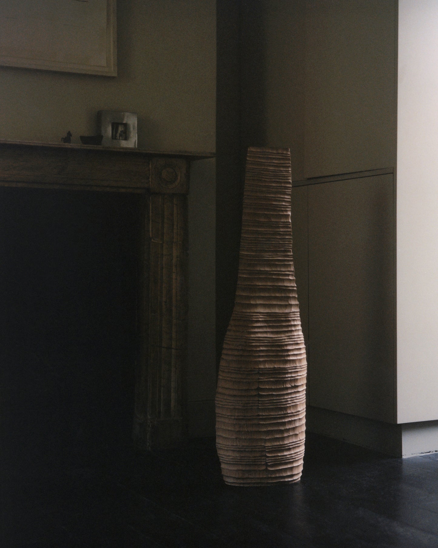 Alternative front view of hand-carved oak sculpture by Malcolm Martin & Gaynor Dowling, featuring a vessel-like form with hand-tooled ridges and a limed, scorched finish.